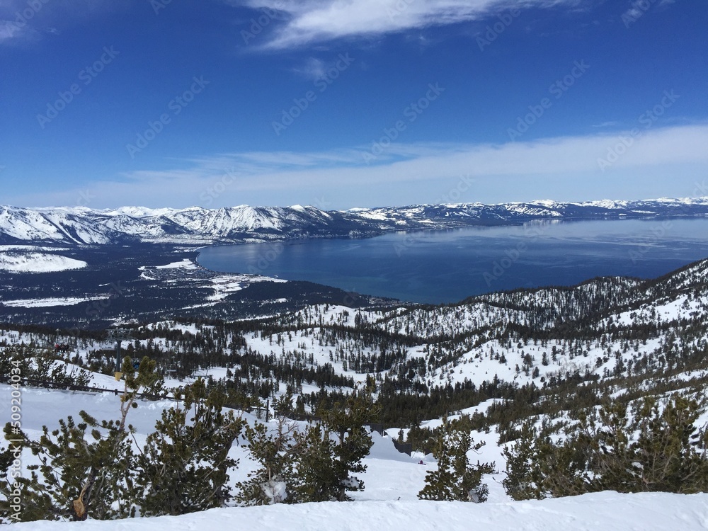 snow covered mountains with lake