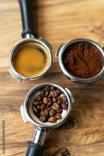Different processes of preparing coffee by a barista in a coffee shop. Coffee beans, ground, ready. Coffee art concept. Top view, close-up.