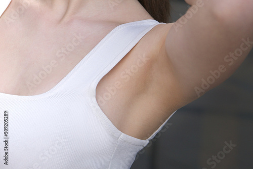 close up photo of clean shaved armpit of unrecognizable girl, young woman