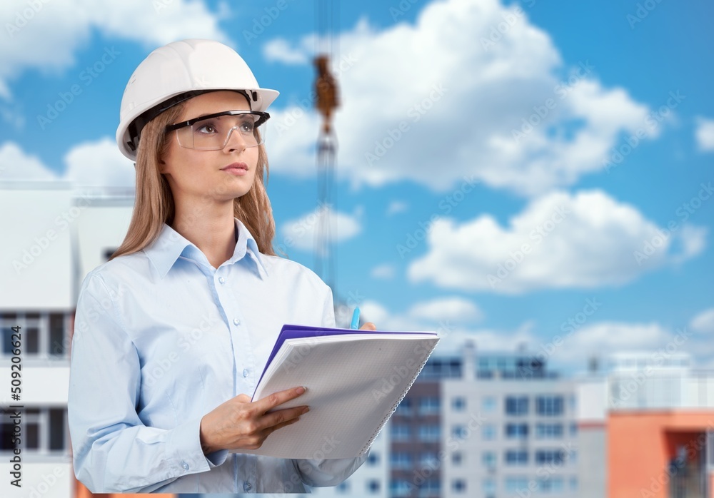 Woman engineer working control machine in factory.