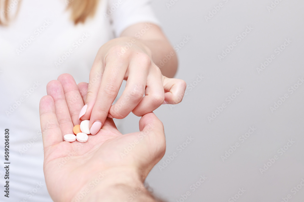 Take a pill from hands close-up. free space for text Take a pill from hands close-up. free space for text