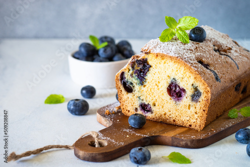 Blueberry cake on white background. Homemade sweet baking.