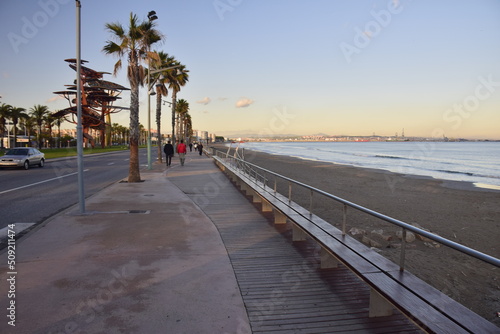 La Pineda, Spain - November 13, 2019:Wooden sidewalk along the beach