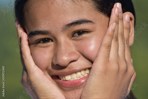 A Smiling Asian Female Teenager