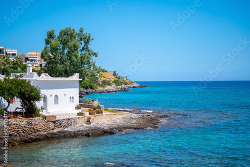 Sea landscape with white ancient beach house. Horizontal image. © zwiebackesser