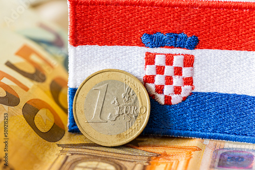 The flag of Croatia against the background of the single currency of the European Union, The concept of Croatia joining the Euro zone photo
