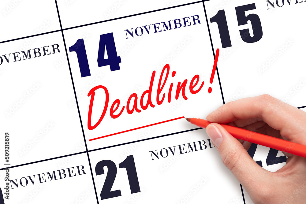 Hand drawing red line and writing the text Deadline on calendar date November 14. Deadline word written on calendar Hand drawing red line and writing the text Deadline on calendar date November 14. Deadline word written on calendar