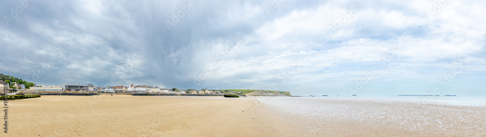 France, normandy landscapes, Beautiful Normandy's coastline on a cloudy day. With the remnants of the mulberry port.