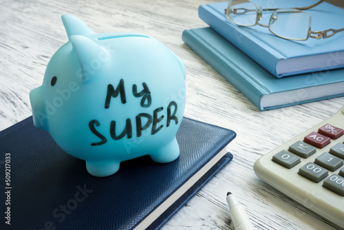 Blue piggy bank with words my super or superannuation fund. photo