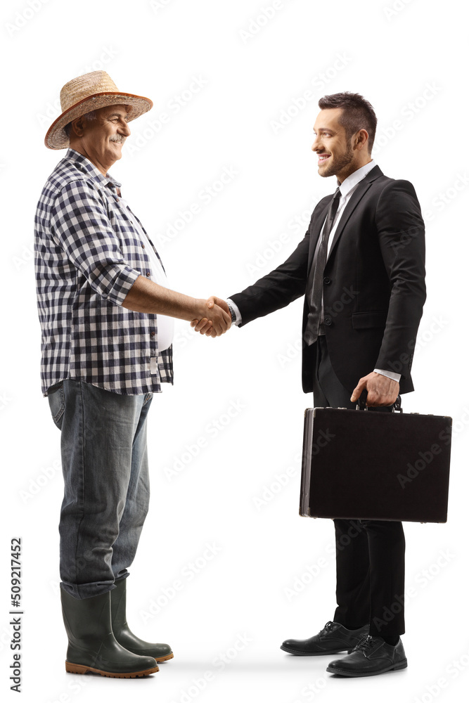 Full length profile shot of a mature farmer shaking hands with businessman Full length profile shot of a mature farmer shaking hands with businessman