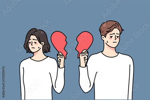 Unhappy couple holding pieces of broken heart suffer from breakup or divorce. Sad upset man and woman struggle with split or separation. Relationships over. Vector illustration. 