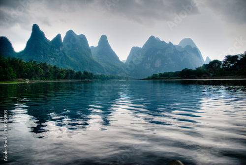 Reflective sunset view of the Li River on the Yangshuo River in Guilin China
