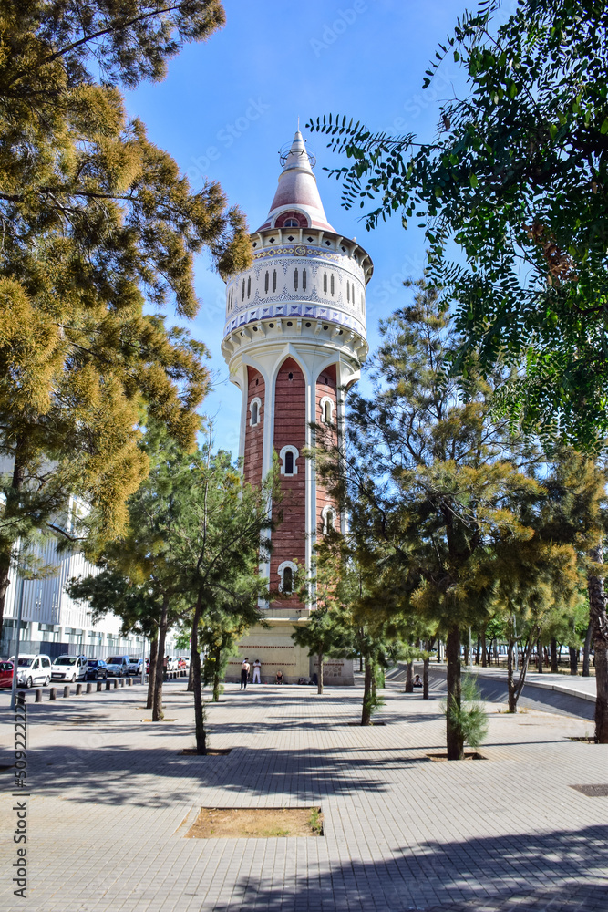 Barcelona, Spain - 3 October 2019: Stylish tiled famous water tower (Torre de les Aigues) from the harbour district of Barcelona.