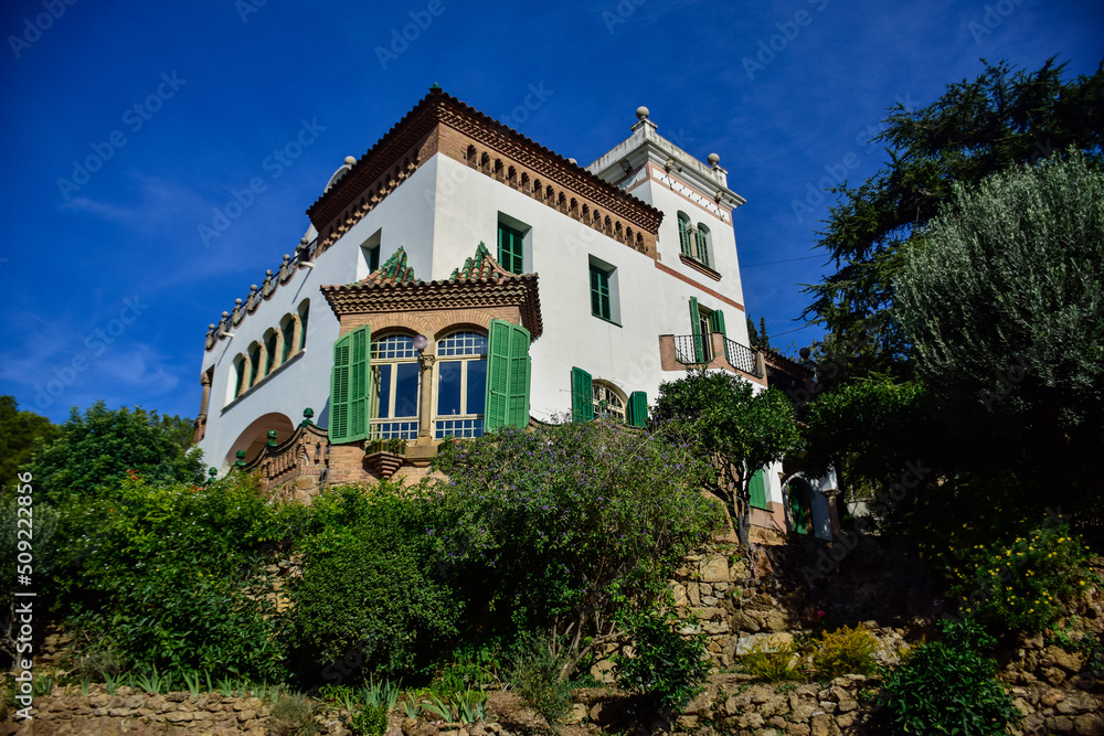 Barcelona, Spain - October 3, 2019: Beautiful white house in Guell Park by architect Gaudi on autumn day in Barcelona, Spain