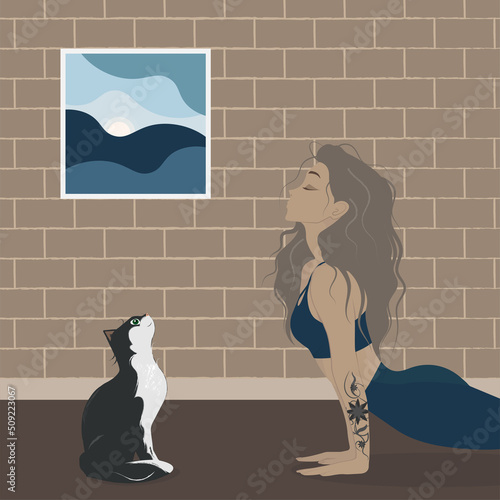 Girl doing yoga with a cat. Healthy lifestyle