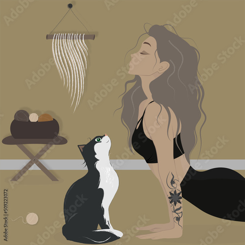 Girl doing yoga with a cat. Healthy lifestyle