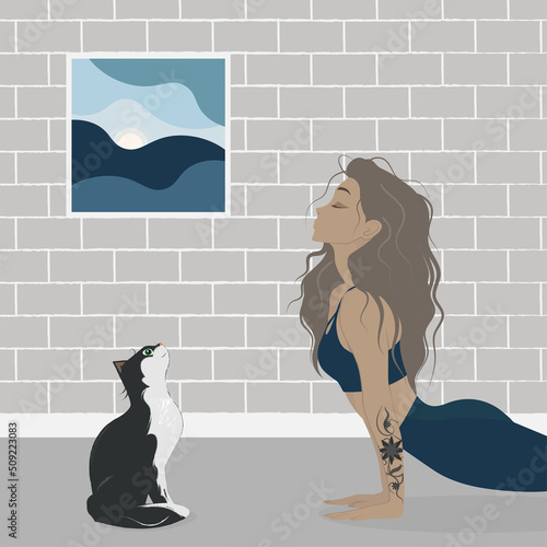 Girl doing yoga with a cat. Healthy lifestyle