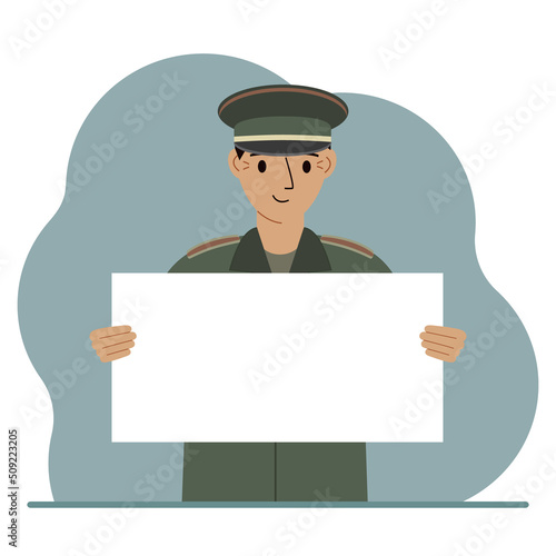 A military man in uniform holds a white sheet of paper in his hands. Concept for advertising, poster, banner.