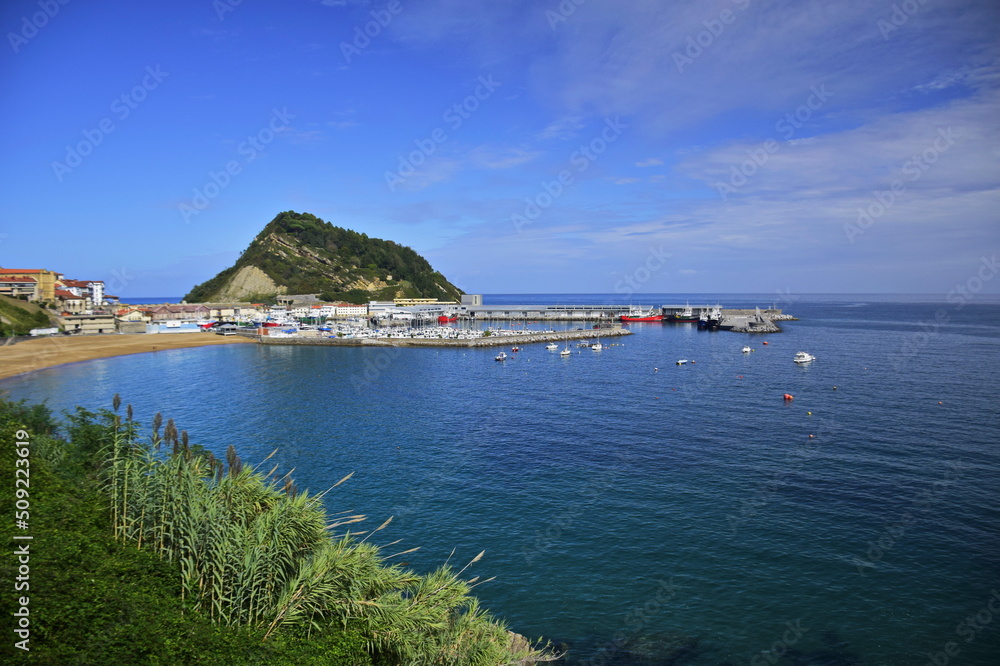 Fototapeta premium View of the ocean and a small port. The Northern Way of St. James, Spain