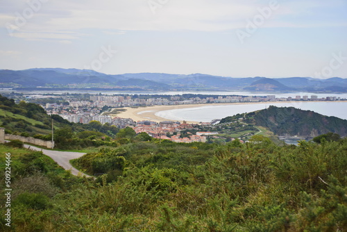 View from the hill to the city and the beach. The Way of St. James, Northern Route, Spain