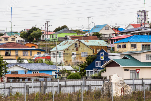 Colorful houses at Porvenir town, capital of both the synonymous commune and the Chilean Province of Tierra del Fuego of Magallanes y la Antártica Chilena Region, Chile photo