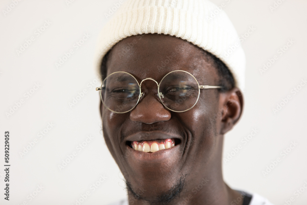 Portrait of an african american man in a white hat and eyeglasses. Portrait of an african american man in a white hat and eyeglasses.