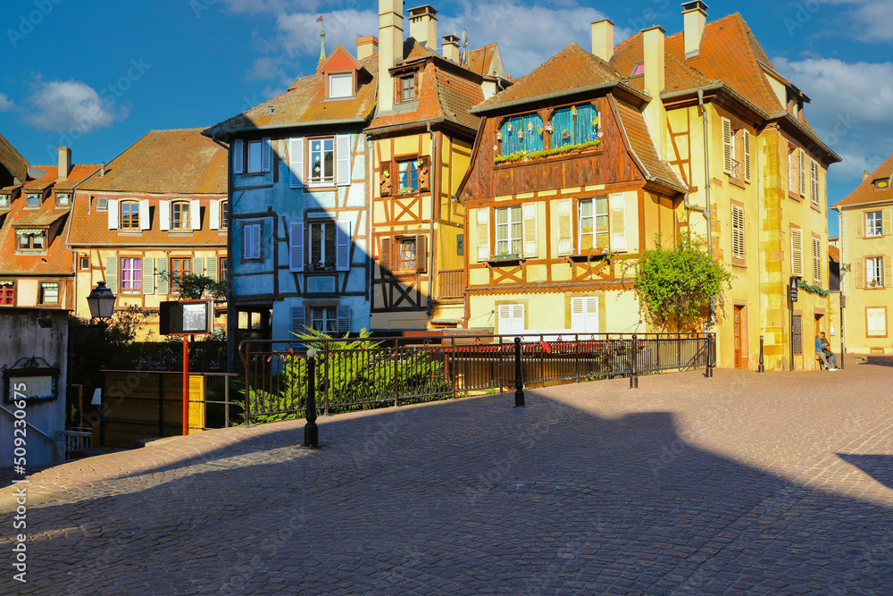 Traditional half-timbered houses on street in Colmar at twilight , Alsace rigion, France