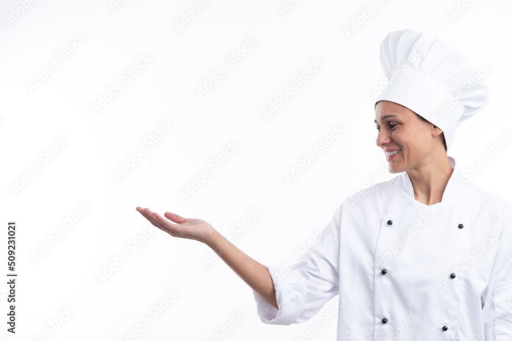 Woman chef with outstretched hand isolated on white background with copy space. Woman chef with outstretched hand isolated on white background with copy space.