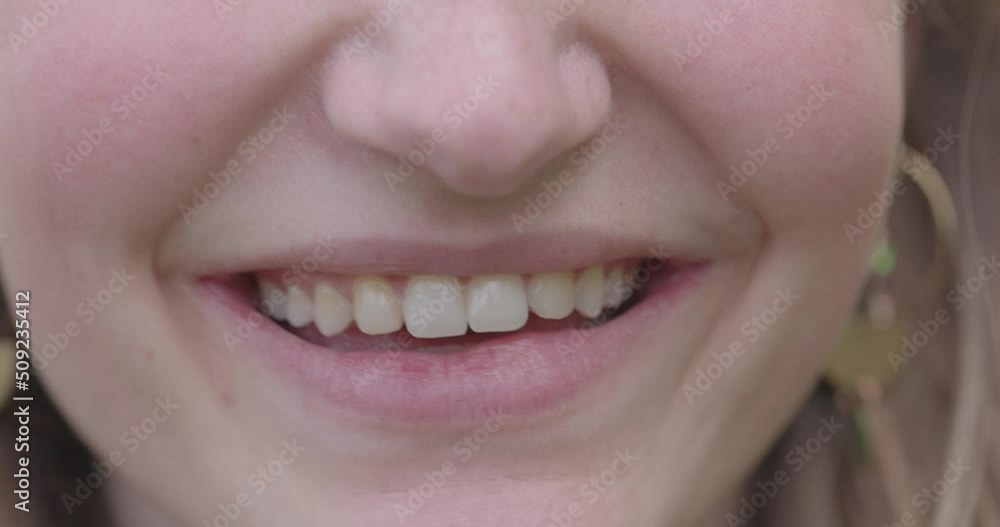Close Up of Smiling Lips after speaking, lower face close up of the face of a pretty young woman. High quality 4k footage Close Up of Smiling Lips after speaking, lower face close up of the face of a pretty young woman. High quality 4k footage