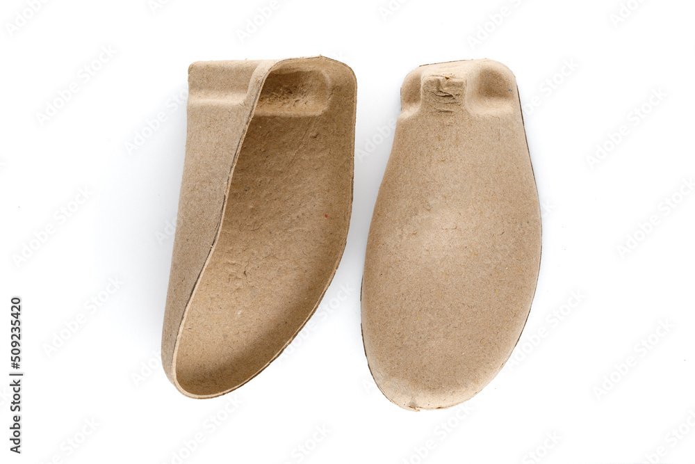 Pair of shoe tree made from recycled cardboard paper isolated on white background, device that used for placed inside a shoe to preserve its shape. Pair of shoe tree made from recycled cardboard paper isolated on white background, device that used for placed inside a shoe to preserve its shape.