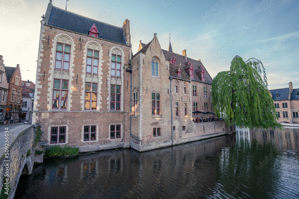 Canal in Bruges and Belfry tower - Houses and Streets - Bruges, Belgium - the city centre Canal in Bruges and Belfry tower - Houses and Streets - Bruges, Belgium - the city centre