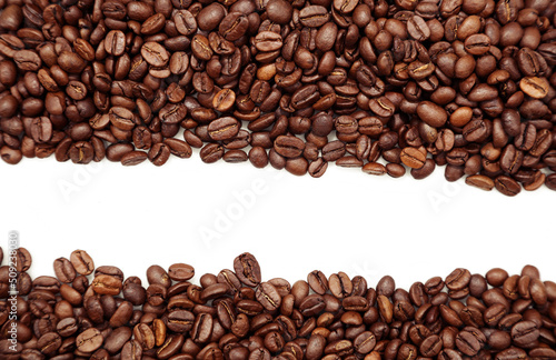 Closeup of roasted brown coffee beans on plain background. Copy space 