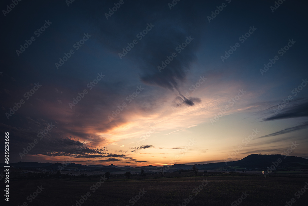 Colorful dramatic sky with cloud and sunset, Czech republic, Ceske stredohori Colorful dramatic sky with cloud and sunset, Czech republic, Ceske stredohori