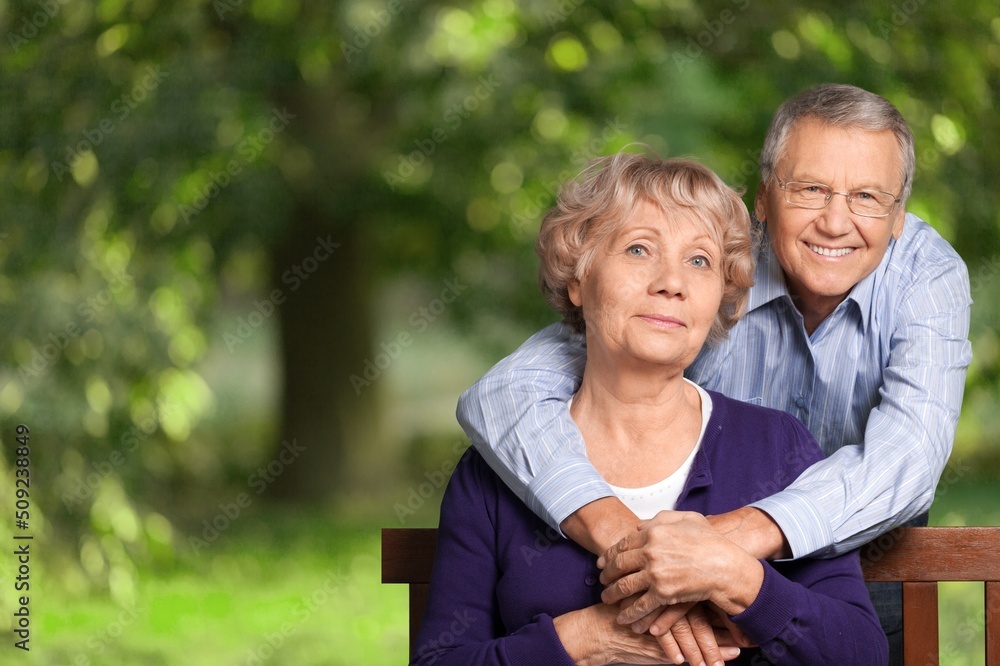 Portrait of happy elderly couple together, take care and love with good relationship, in the park Portrait of happy elderly couple together, take care and love with good relationship, in the park