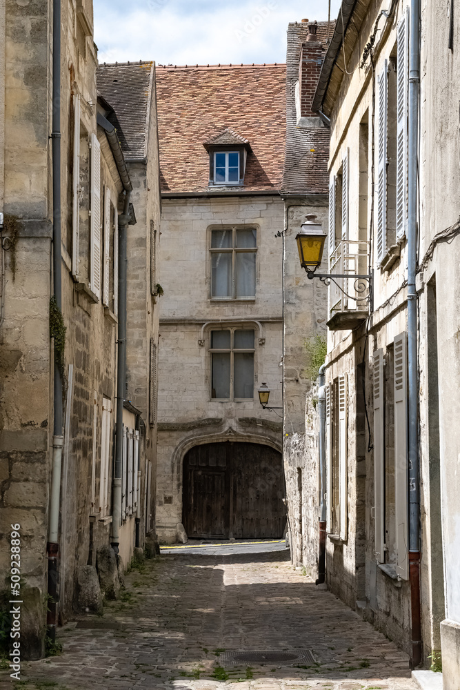 Senlis, medieval city in France, typical street with ancient houses
