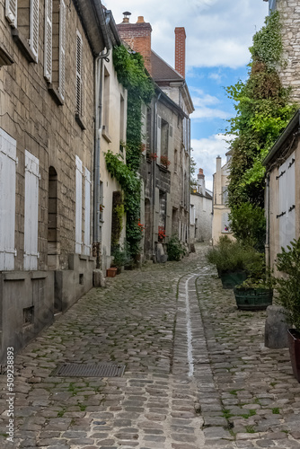 Senlis, medieval city in France, typical street with ancient houses 