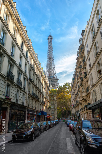Eiffel tower between buildings in Paris © adisa