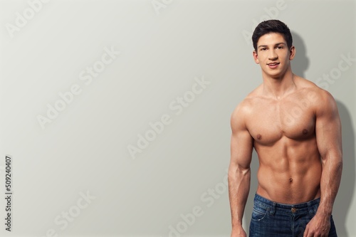 Portrait of sexy man posing on outdoor background