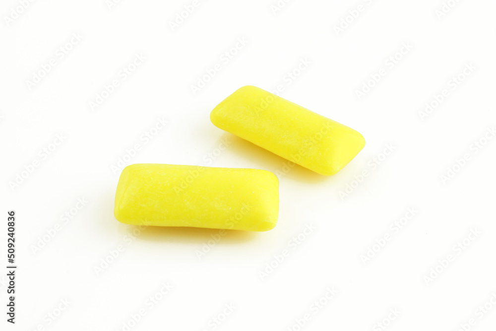 Two yellow peppermint gums isolated on white background. Chewy bubblegums Two yellow peppermint gums isolated on white background. Chewy bubblegums
