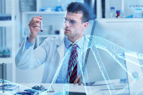 Scientist with tube pcr and virtual screen with data scientific at genetic engineering lab. Biomedical engineer genetic working with tubes in biotechnical laboratory photo