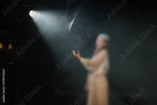 Fotografie, Obraz actress performing on stage in front of spotlight