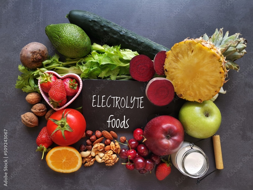 Electrolyte-rich fruits like bananas and oranges in a bowl.