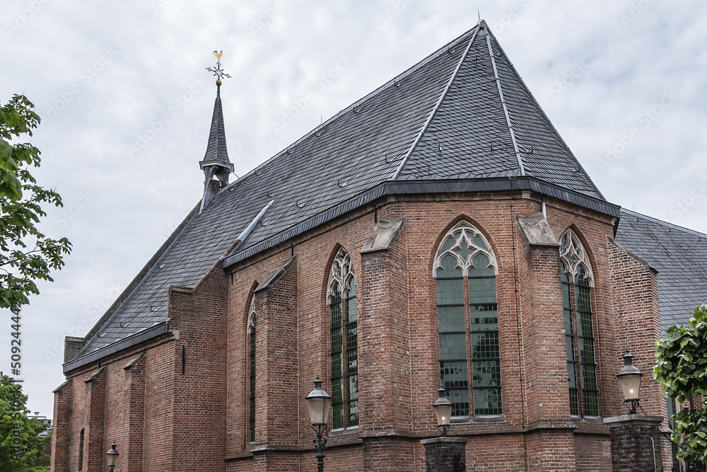 Intimate Chapel from 1390 with its beautiful arched windows and men's hall (Mannenzaal) behind it - remained from medieval building of St. Pieters en Bloklands Gasthuis. Amersfoort, the Netherlands.
