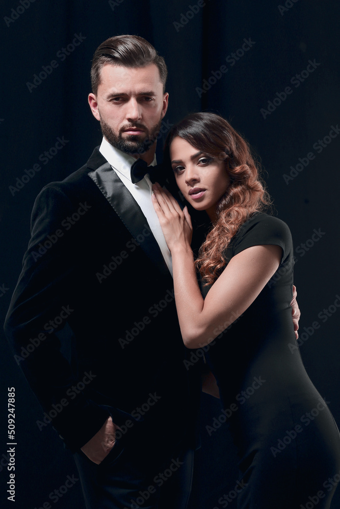 portrait of fashion couple on black background portrait of fashion couple on black background