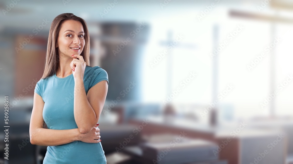 Corporate woman in office smiling, greeting business partner