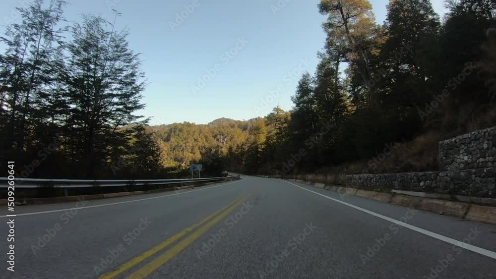 Traveling along the highway across the hills and forest, in a sunny day. Traveling along the highway across the hills and forest, in a sunny day.