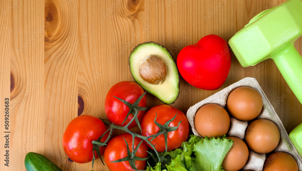 Flat lay of healthy product near heart and dumbbells. Diet and detox. Healthy eating habits. Sporty lifestyle. Workouts Flat lay of healthy product near heart and dumbbells. Diet and detox. Healthy eating habits. Sporty lifestyle. Workouts
