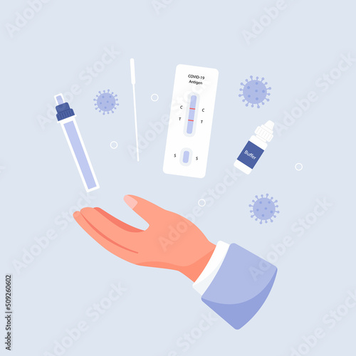Doctor holding antigen test kit photo