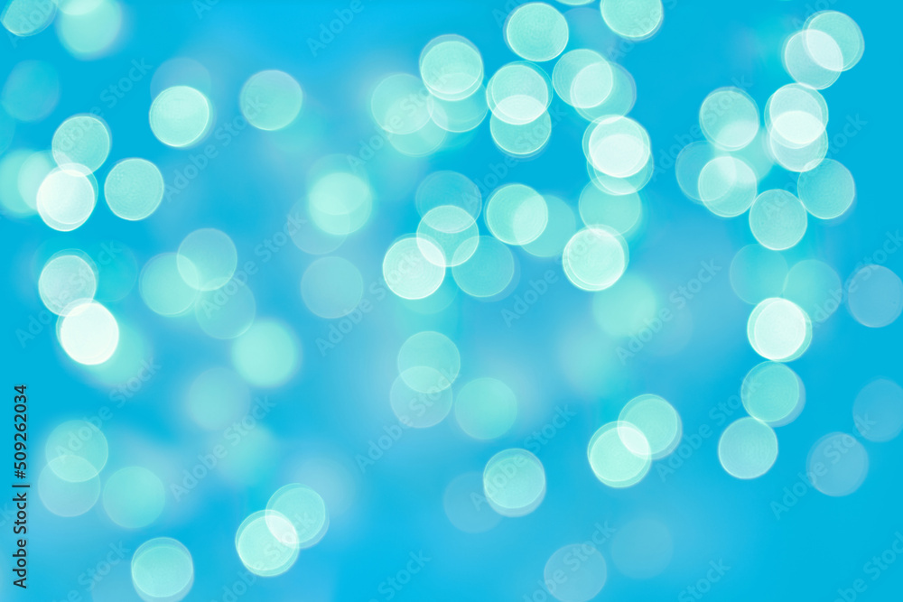 Glowing bokeh lights on a blue background. Backdrop for postcard business card design Glowing bokeh lights on a blue background. Backdrop for postcard business card design