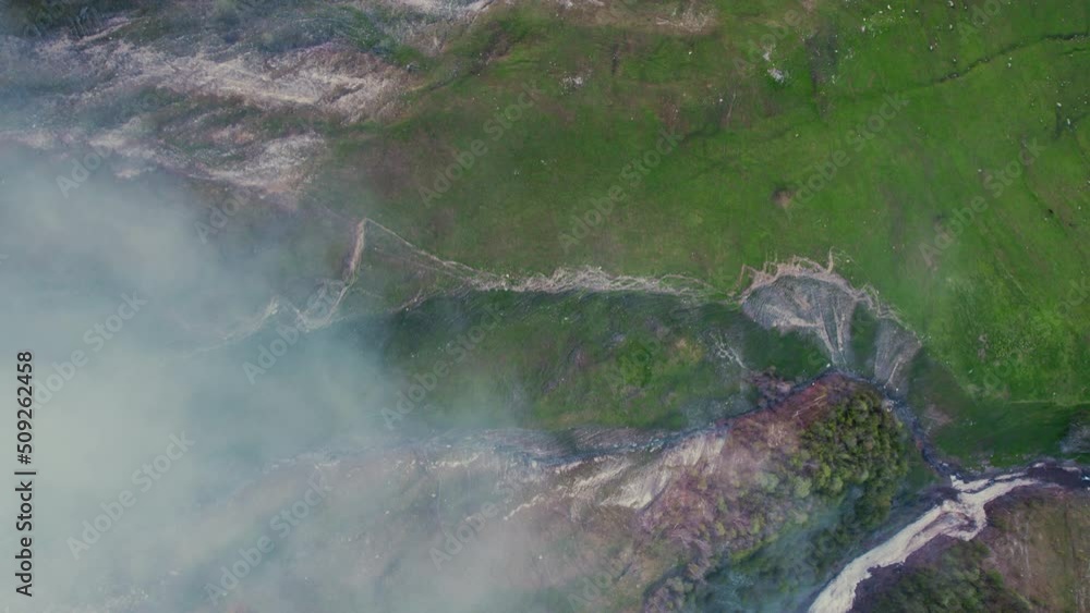river valley in the Caucasus mountains in cloudy weather. top-donwn view. High quality 4k footage river valley in the Caucasus mountains in cloudy weather. top-donwn view. High quality 4k footage